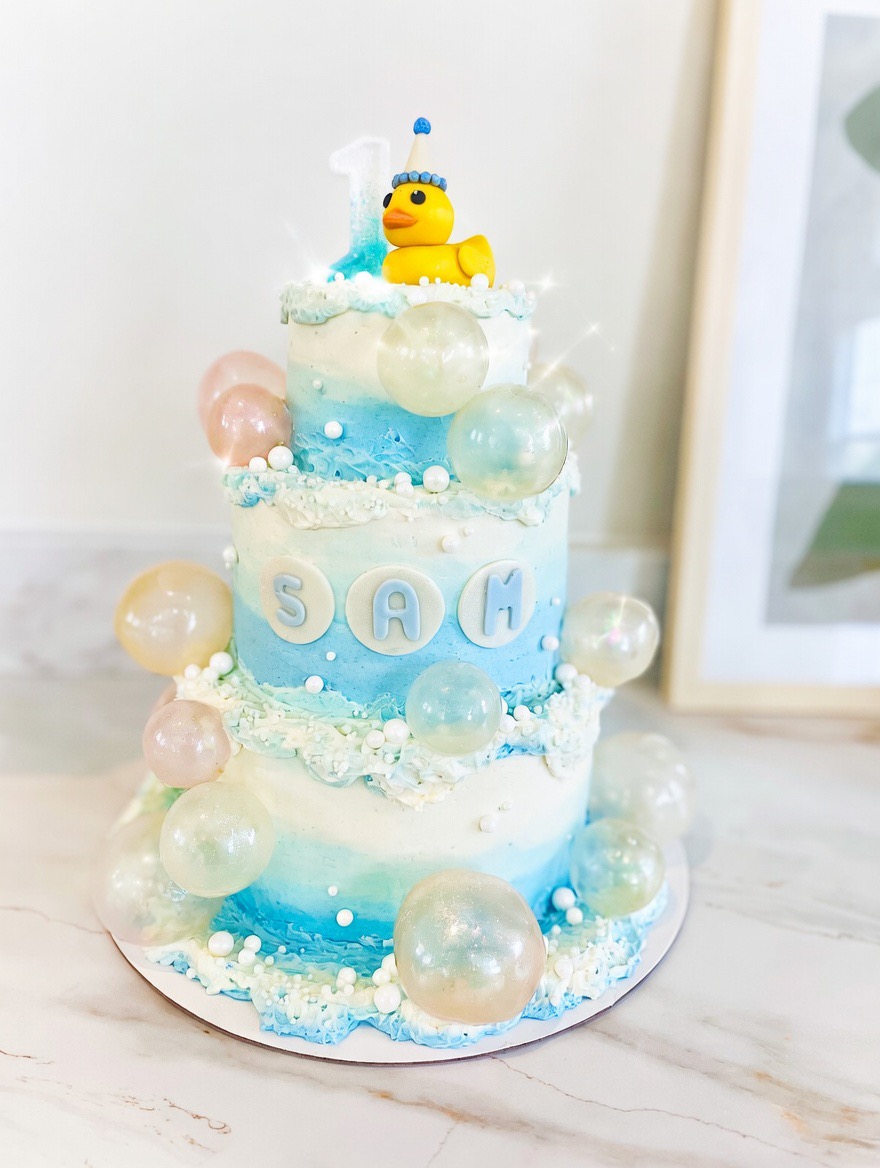 Lucky Duck First Birthday Cake with edible bubbles